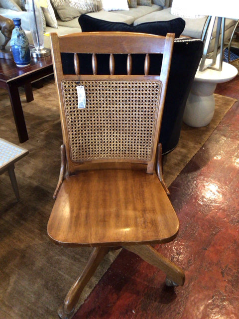 Vintage Caned Rolling Armless Brown Chair