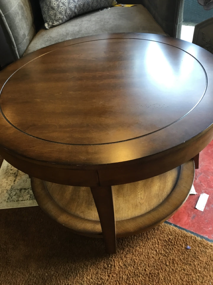 Ashley Wood Round Rolling Brown Coffee Table