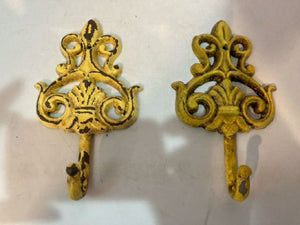 Pair Yellow Iron Coat Hooks