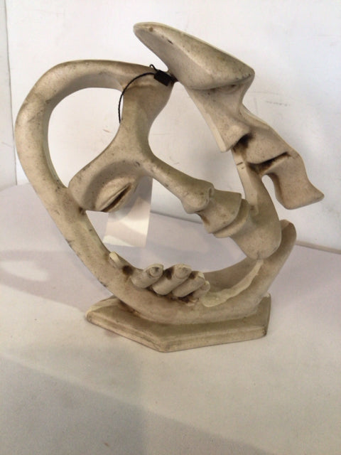 White Resin Faces Sculpture